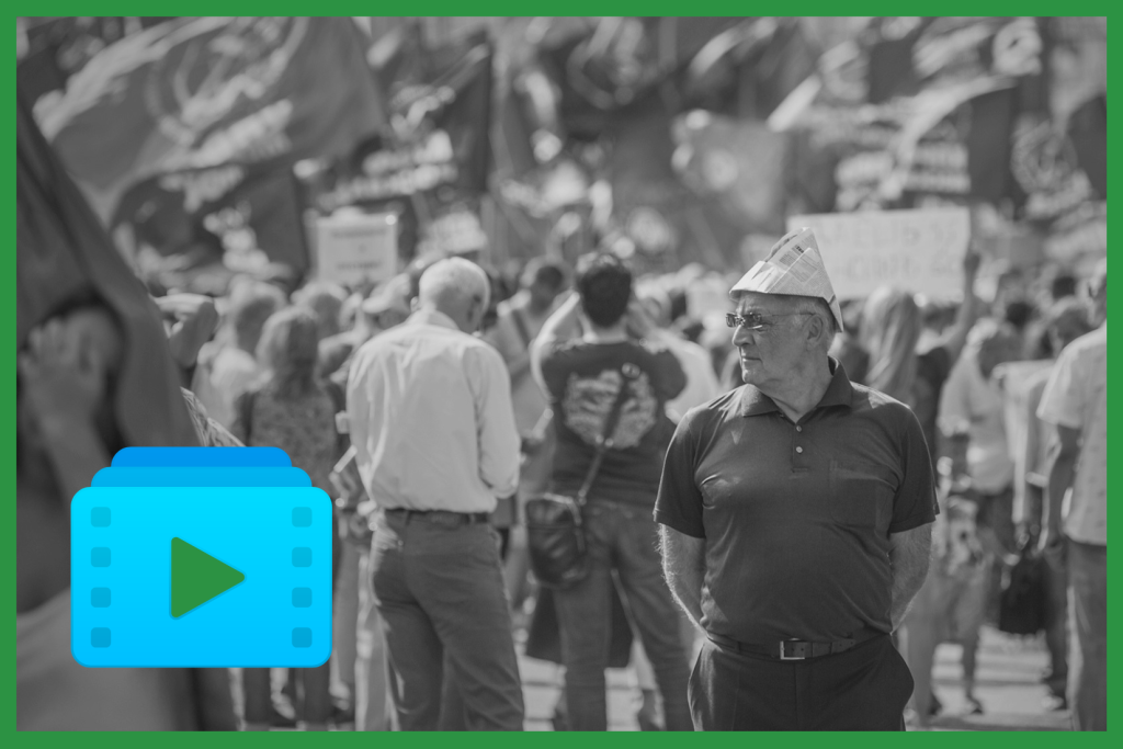 black and white photo from a demonstration with a man wearing a paper hat in the foreground. A graphic image symbolizing a playlist has been added in blue and green
